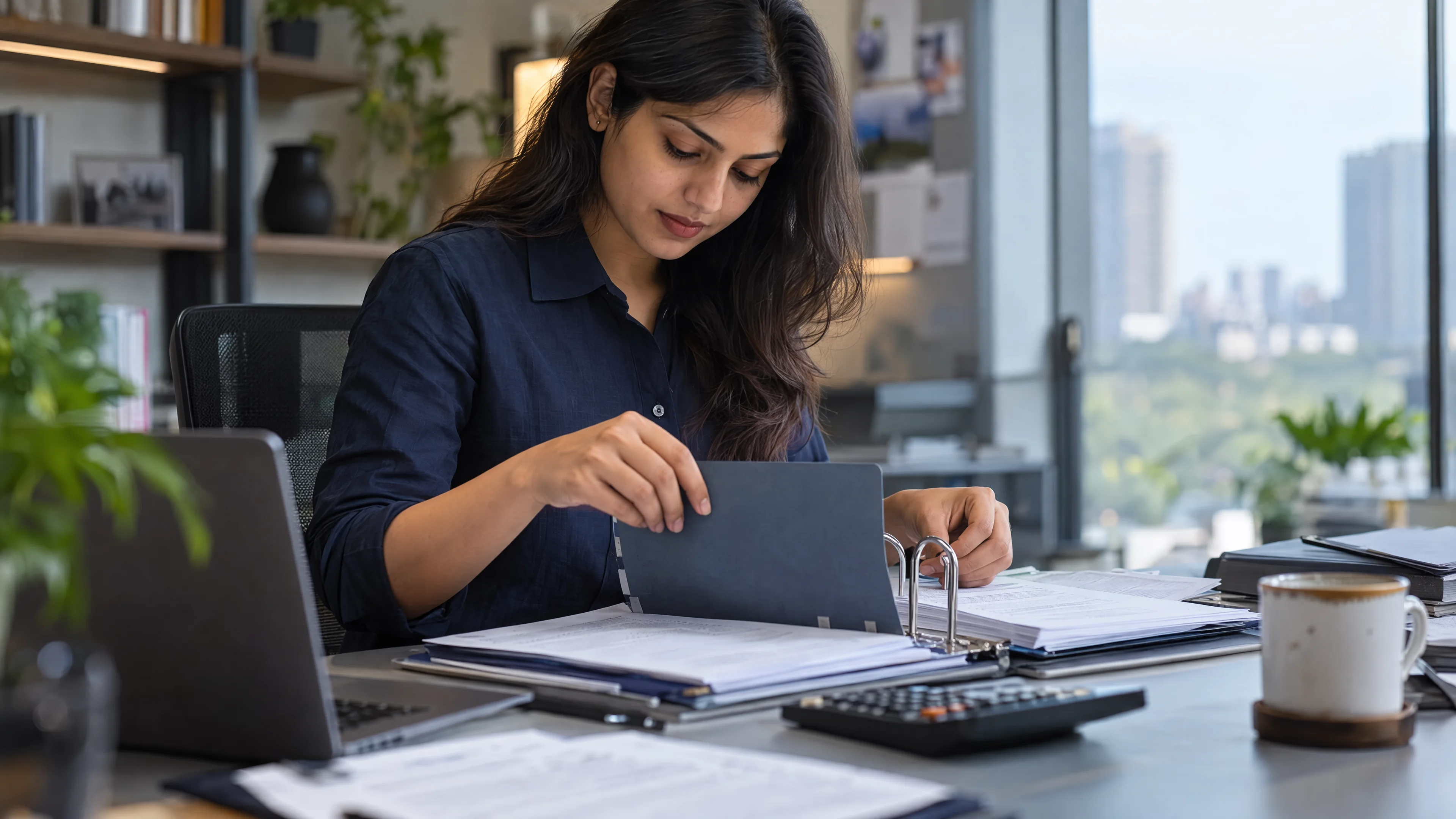 Finance specialist organising a monthly reporting pack.
